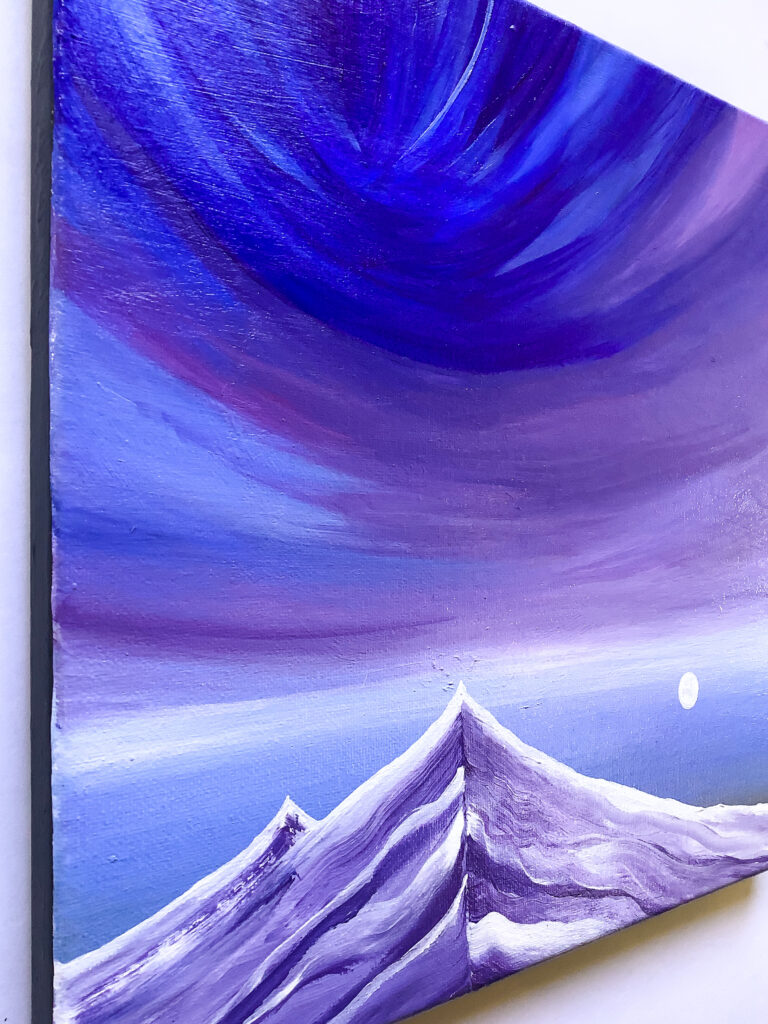 Side view of a painting of a little moon beside the mountain of lavender streaks just below an extravagant upturned sky.